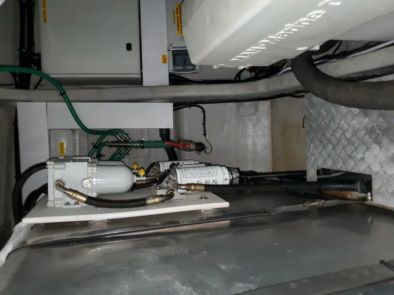 Slide: The Image of Engine room of 2007 Sunseeker Predator 55 yacht, showing mechanical components and wiring. - 49