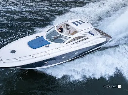 Slide: The Image of 2007 Sunseeker Predator 55 yacht cruising on open water, showcasing sleek design and luxury. - 5
