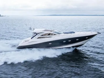Slide: The Image of 2007 Sunseeker Predator 55 yacht cruising on open water. - 6