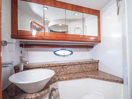 Slide: The Image of Luxurious bathroom in 2007 Sunseeker Predator 55 yacht with modern fixtures and granite countertop. - 8
