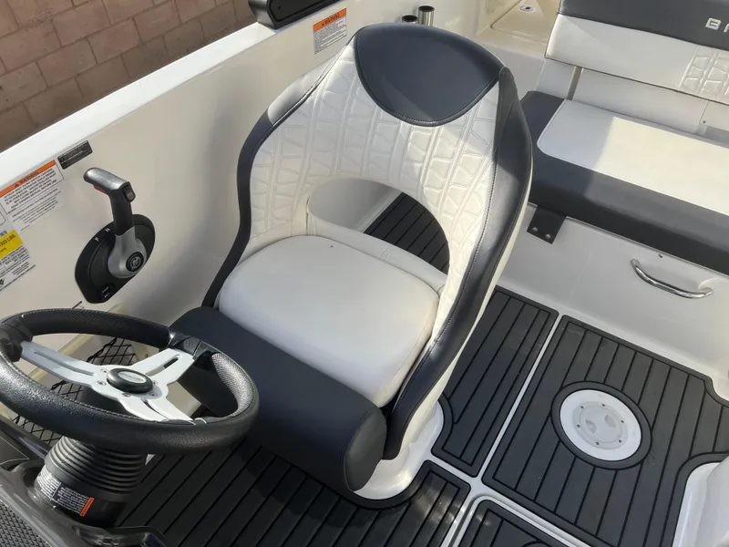 Slide: The Image of 2021 Bayliner VR5 Bowrider I/O interior with steering wheel and seating. - 16