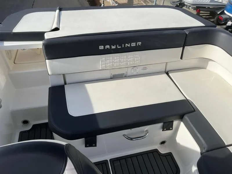 Slide: The Image of 2021 Bayliner VR5 Bowrider I/O boat interior with cushioned seating and storage. - 17
