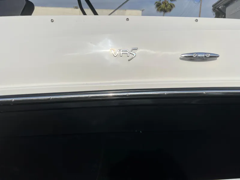 Slide: The Image of 2021 Bayliner VR5 Bowrider I/O boat exterior with logo detail. - 23