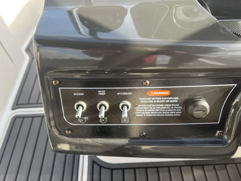 Slide: The Image of Control panel of 2021 Bayliner VR5 Bowrider I/O with switches for blower, bilge pump, and accessory. - 24