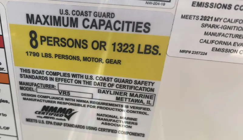 Slide: The Image of Bayliner VR5 Bowrider I/O 2021 capacity label: 8 persons or 1323 lbs, U.S. Coast Guard compliant. - 26