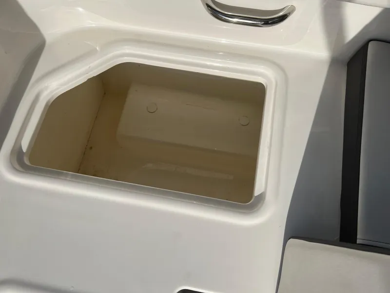 Slide: The Image of Storage compartment on 2021 Bayliner VR5 Bowrider I/O boat, featuring sleek design and functionality. - 27