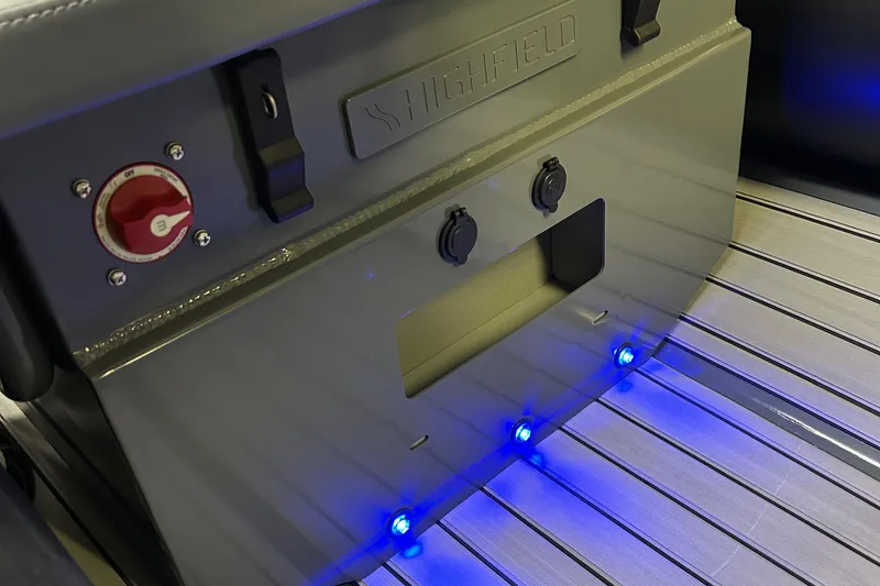 Slide: The Image of 2024 Highfield Classic 380 FCT boat interior with blue LED lights and control panel. - 12