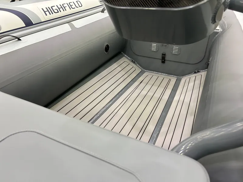 Slide: The Image of 2024 Highfield Classic 380 FCT boat interior with sleek, modern design and durable flooring. - 5