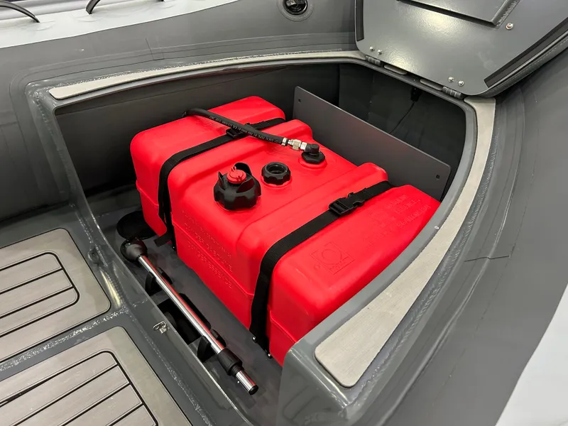 Slide: The Image of 2024 Highfield Classic 380 FCT boat with red fuel tank in storage compartment. - 7