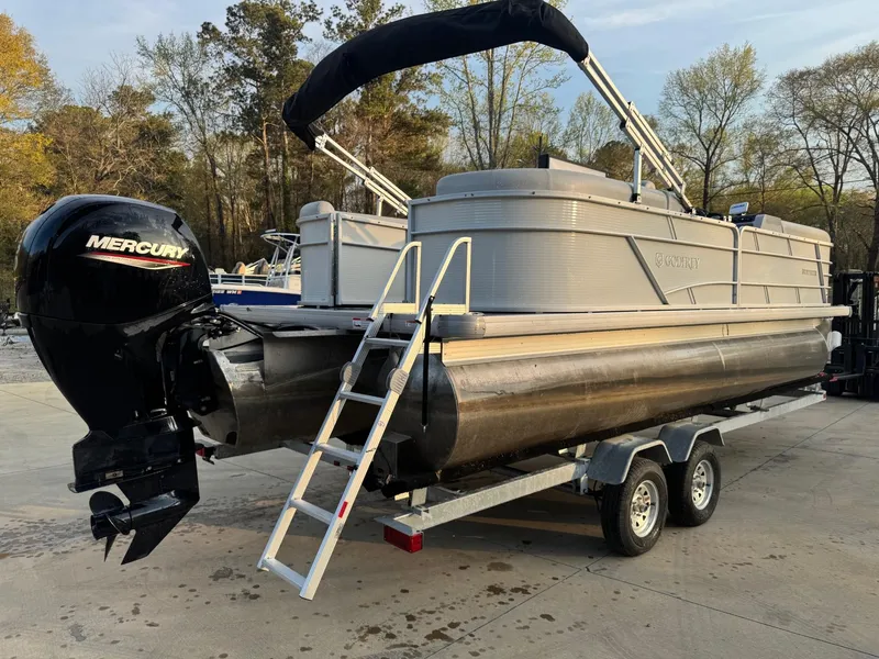 Slide: The Image of 2022 Godfrey 2286 pontoon boat on trailer with Mercury outboard motor. - 3
