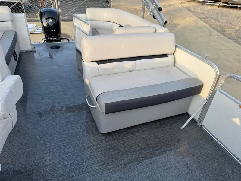 Slide: The Image of 2022 Godfrey 2286 pontoon boat with gray seating and outboard motor. - 7