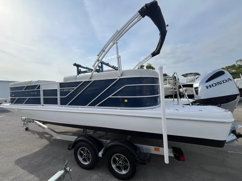 Slide: The Image of 2021 Hurricane FunDeck 236SB OB boat on trailer with Honda outboard motor. - 3