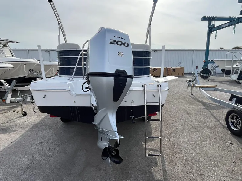 Slide: The Image of 2021 Hurricane FunDeck 236SB OB boat with 200 horsepower outboard motor, rear view. - 5