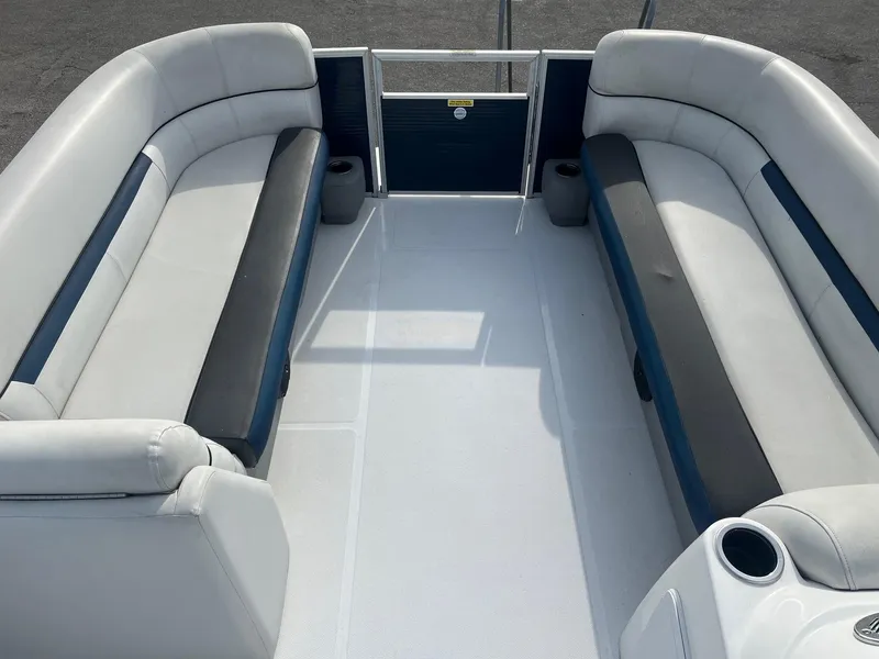 Slide: The Image of 2021 Hurricane FunDeck 236SB OB interior with spacious seating and cup holders. - 9