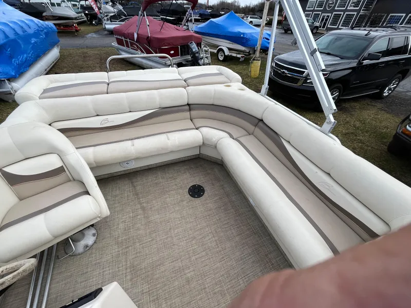 Slide: The Image of Bennington LX 2280 pontoon boat interior with beige seating, 1998 model. - 6