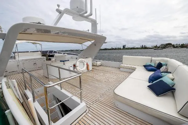 Slide: The Image of Luxurious 1999 Azimut yacht deck with seating, ocean view, and modern amenities. - 21