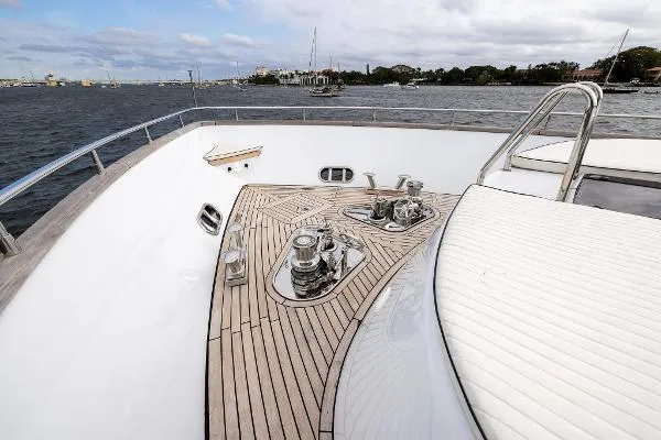 Slide: The Image of Luxurious 1999 Azimut yacht deck with sleek wood finish and ocean view. - 24