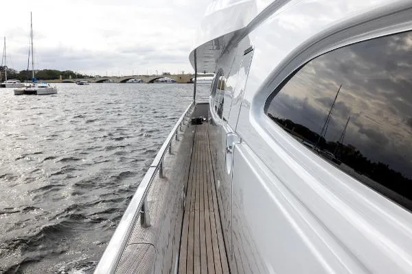 Slide: The Image of 1999 Azimut 5 Stateroom VIP Edition yacht on water, side view with reflection. - 26