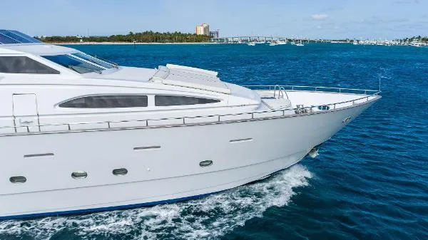 Slide: The Image of Luxurious 1999 Azimut 5 Stateroom VIP Edition yacht cruising on blue ocean waters. - 4