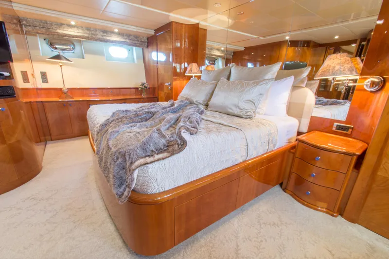 Slide: The Image of Luxurious bedroom in 1999 Azimut 5 Stateroom VIP Edition yacht with elegant wood finishes. - 46