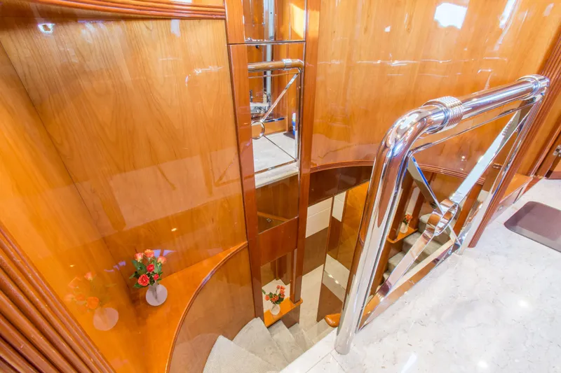 Slide: The Image of Luxurious wooden staircase with chrome railing on 1999 Azimut 5 Stateroom VIP Edition yacht. - 48