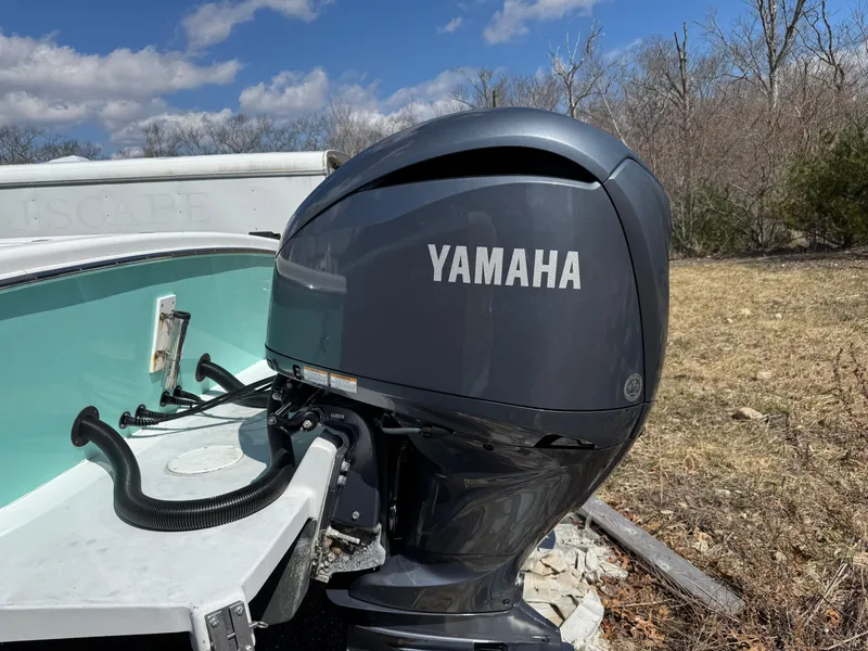 Slide: The Image of 2006 Buddy Davis 28 Center Console with Yamaha outboard motor, outdoors on a sunny day. - 4