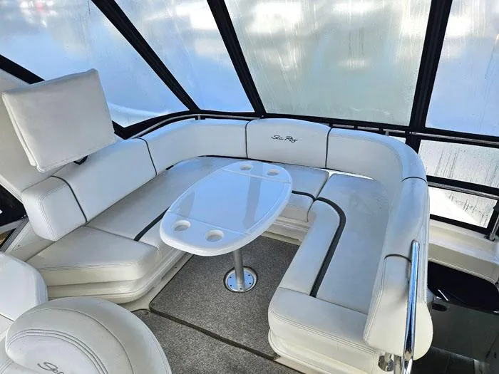 Slide: The Image of Luxurious seating area on 2006 Sea Ray 44 Sedan Bridge yacht with white upholstery. - 16