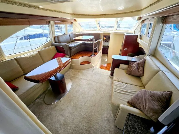 Slide: The Image of Luxurious interior of a 2006 Sea Ray 44 Sedan Bridge yacht with plush seating and elegant design. - 6