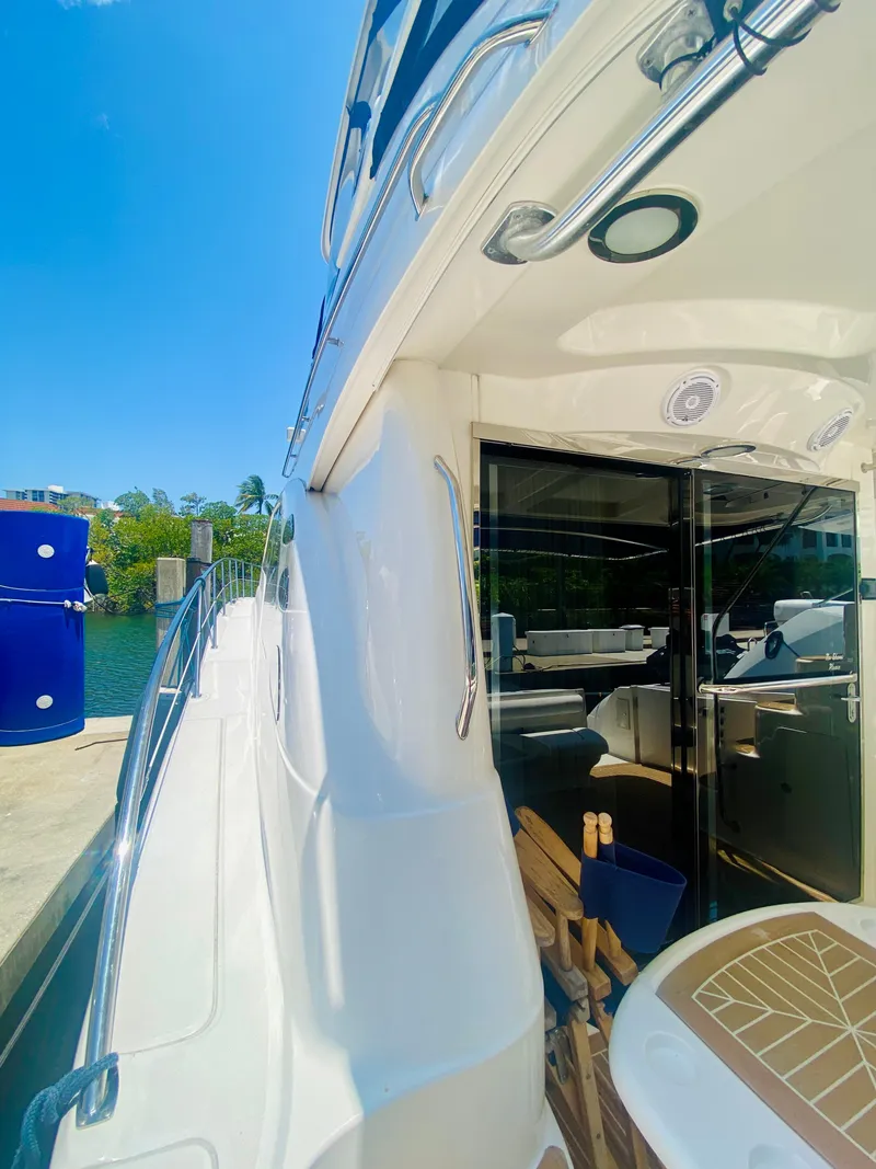Slide: The Image of 2006 Sea Ray 580 Sedan Bridge yacht docked, showcasing sleek exterior and luxurious interior. - 15