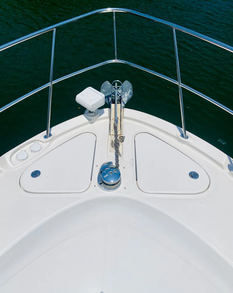 Slide: The Image of Bow of 2006 Sea Ray 580 Sedan Bridge yacht with anchor and railing. - 17