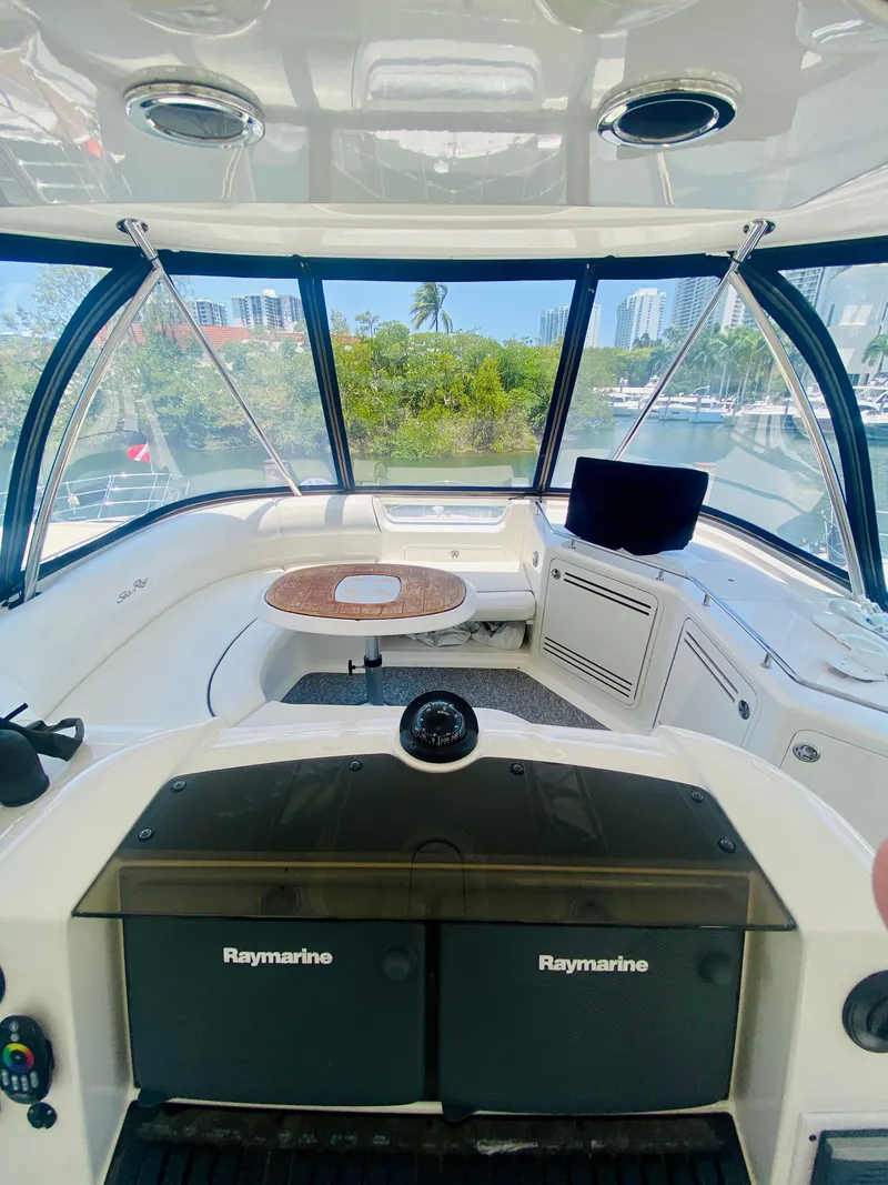 Slide: The Image of Interior view of 2006 Sea Ray 580 Sedan Bridge yacht with navigation equipment. - 23