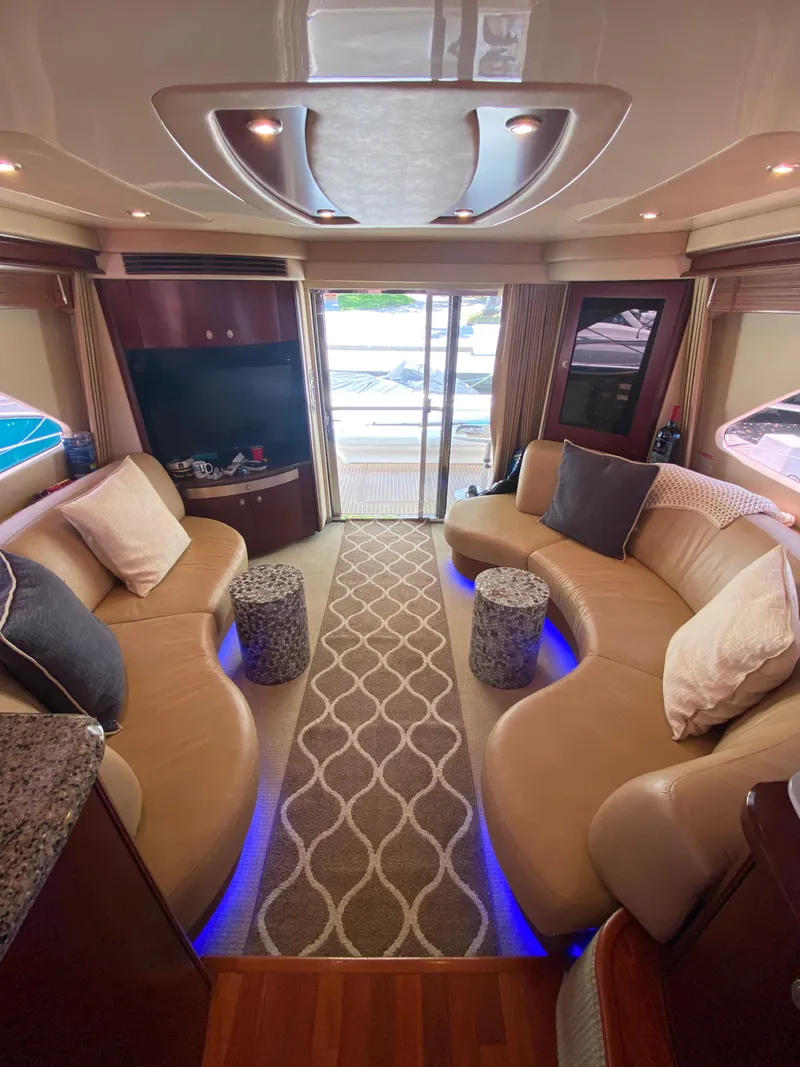 Slide: The Image of Luxurious interior of 2006 Sea Ray 580 Sedan Bridge with plush seating and modern decor. - 32