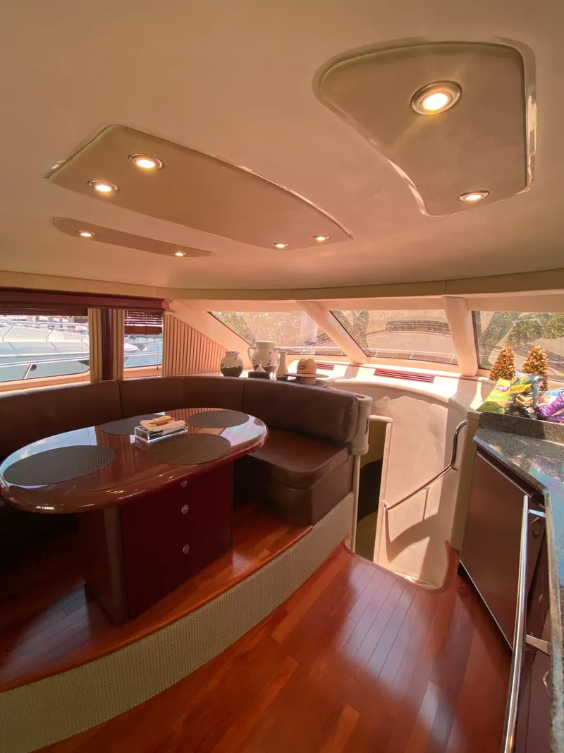 Slide: The Image of Luxurious interior of 2006 Sea Ray 580 Sedan Bridge yacht with elegant seating and wood flooring. - 35