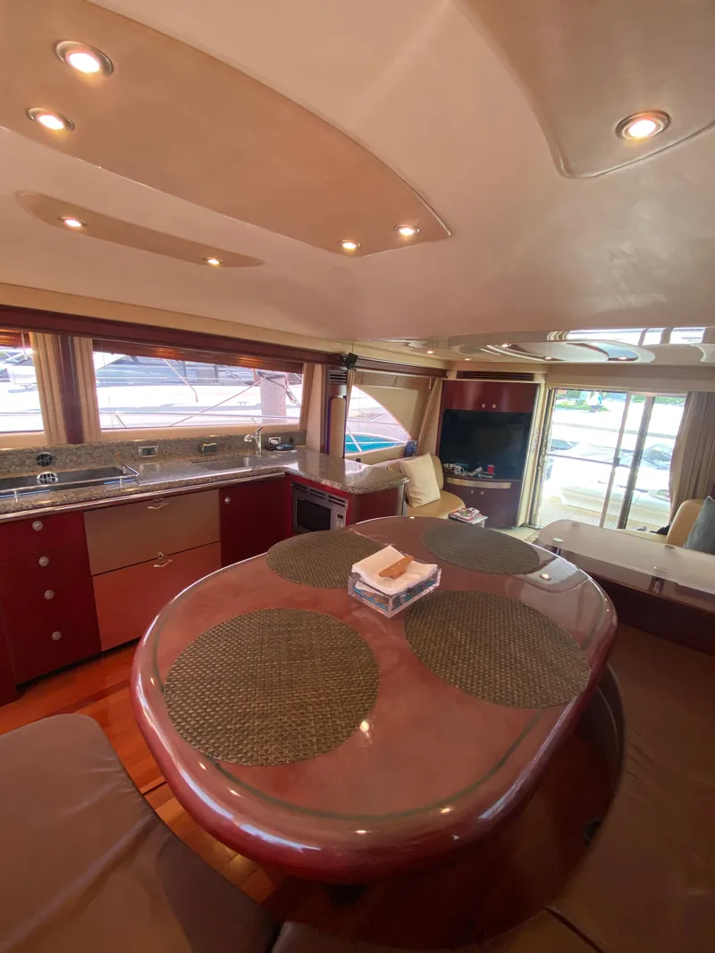 Slide: The Image of Luxurious interior of 2006 Sea Ray 580 Sedan Bridge yacht with dining area and kitchen. - 36
