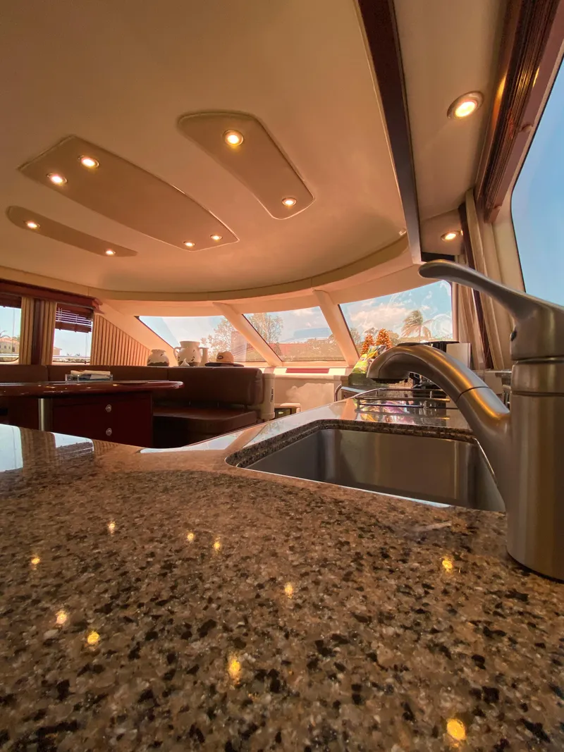Slide: The Image of Luxurious 2006 Sea Ray 580 Sedan Bridge interior with granite countertops and modern fixtures. - 39