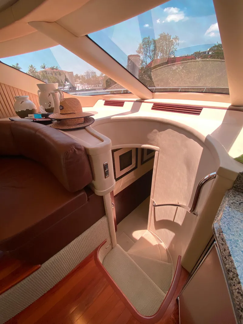 Slide: The Image of Interior of 2006 Sea Ray 580 Sedan Bridge yacht with luxurious seating and staircase. - 43