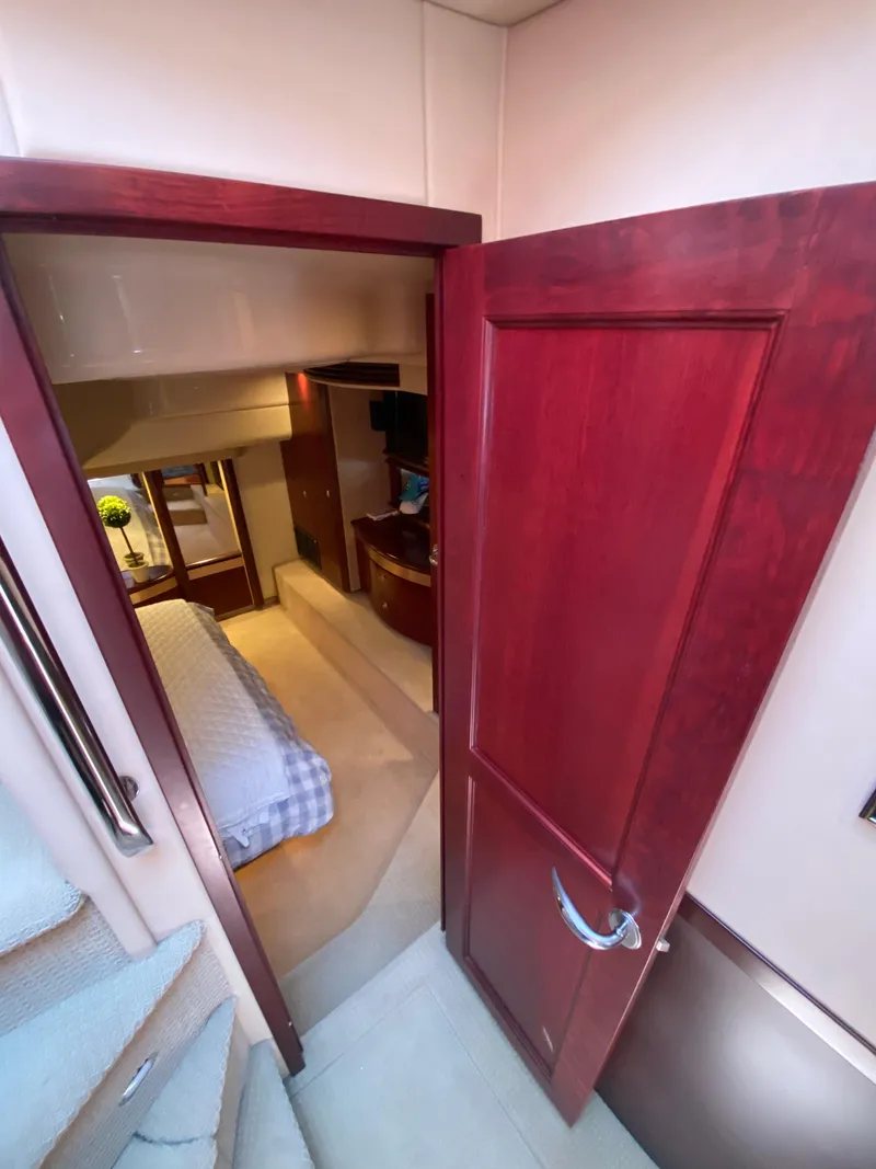Slide: The Image of Interior view of 2006 Sea Ray 580 Sedan Bridge yacht bedroom. - 44