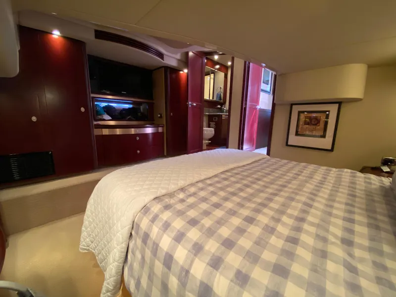 Slide: The Image of Luxurious cabin interior of 2006 Sea Ray 580 Sedan Bridge yacht with cozy bedding. - 47