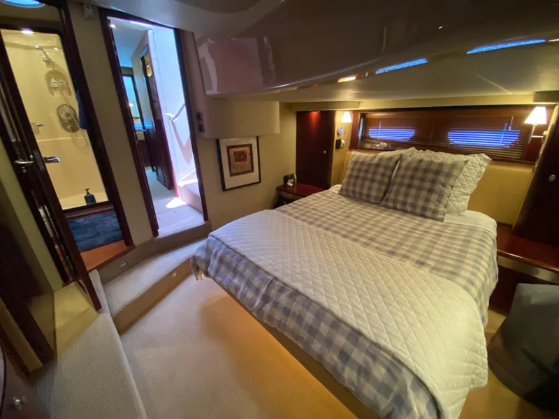 Slide: The Image of Luxurious bedroom interior of 2006 Sea Ray 580 Sedan Bridge yacht. - 48