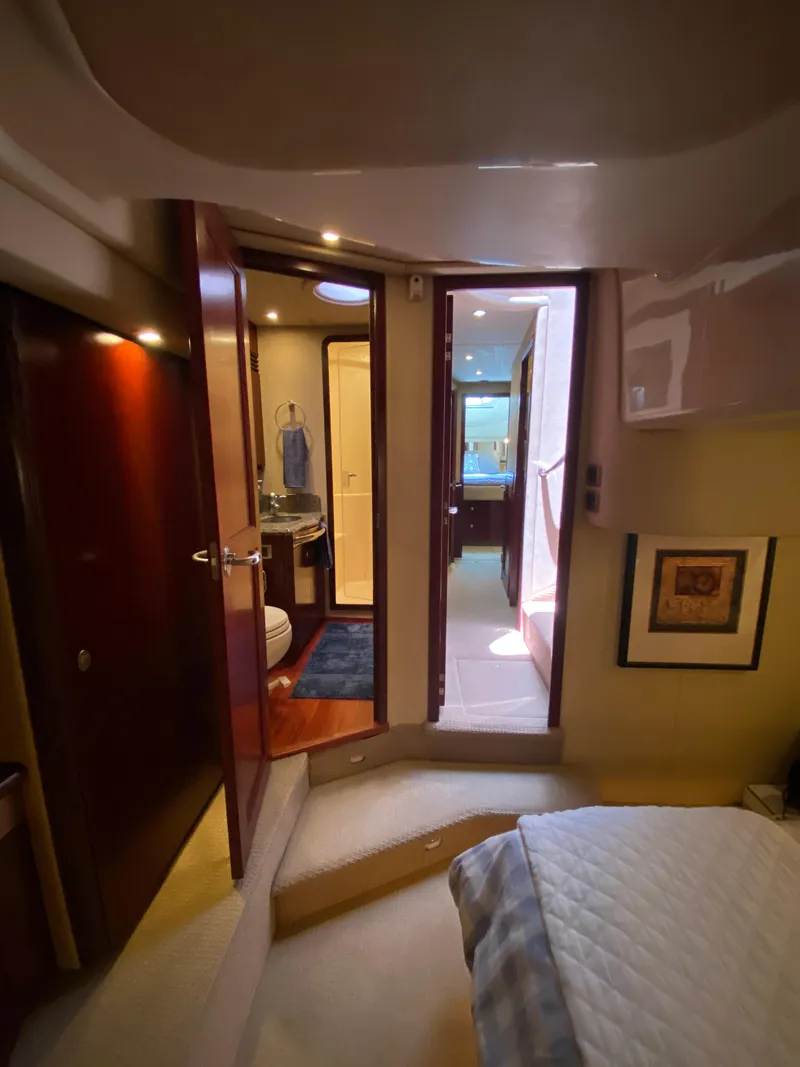 Slide: The Image of Interior of 2006 Sea Ray 580 Sedan Bridge yacht, featuring a cozy cabin and bathroom. - 49