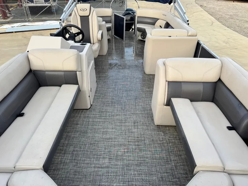 Slide: The Image of 2023 Harris 230 CRUISER boat interior with spacious seating and modern design. - 4