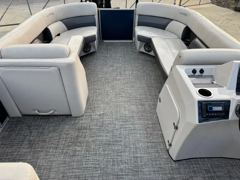 Slide: The Image of 2023 Harris 230 CRUISER pontoon boat interior with spacious seating and modern console. - 5