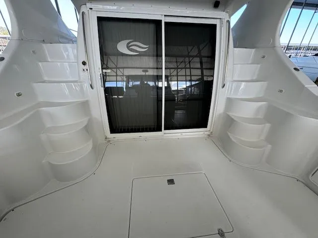 Slide: The Image of 2003 Carver 410 Sport Sedan yacht interior with sliding glass door and steps. - 20