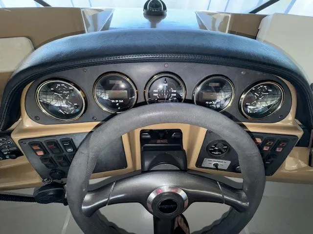 Slide: The Image of Dashboard of a 2003 Carver 410 Sport Sedan with steering wheel and gauges. - 29