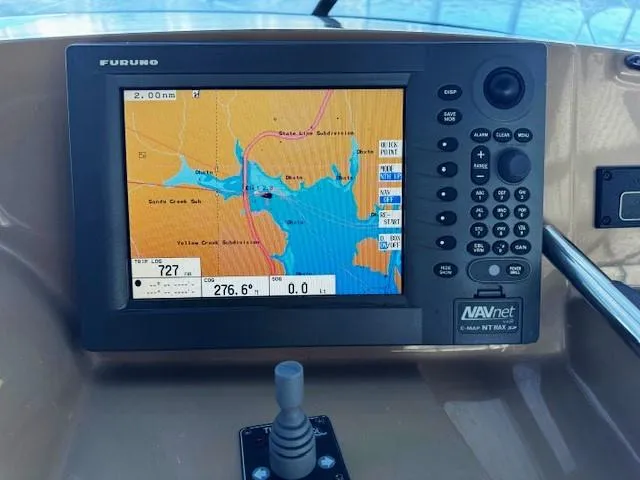 Slide: The Image of Navigation system on a 2003 Carver 410 Sport Sedan displaying a nautical map. - 30
