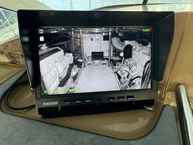 Slide: The Image of Monitor displaying engine room of 2003 Carver 410 Sport Sedan yacht. - 32