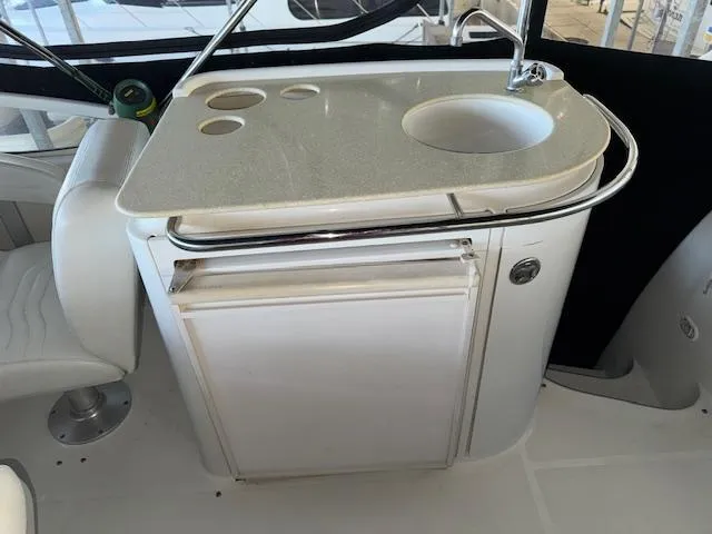 Slide: The Image of 2003 Carver 410 Sport Sedan yacht kitchenette with sink and storage. - 37