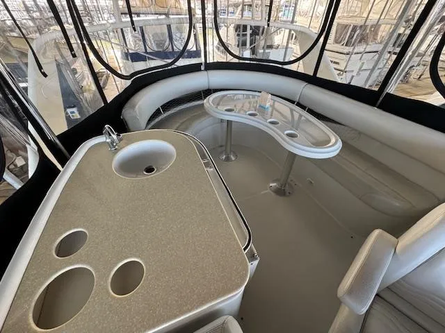 Slide: The Image of 2003 Carver 410 Sport Sedan interior with seating and built-in sink. - 38