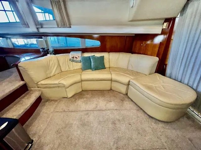 Slide: The Image of Luxurious interior of 2003 Carver 410 Sport Sedan with cream leather sectional sofa. - 42
