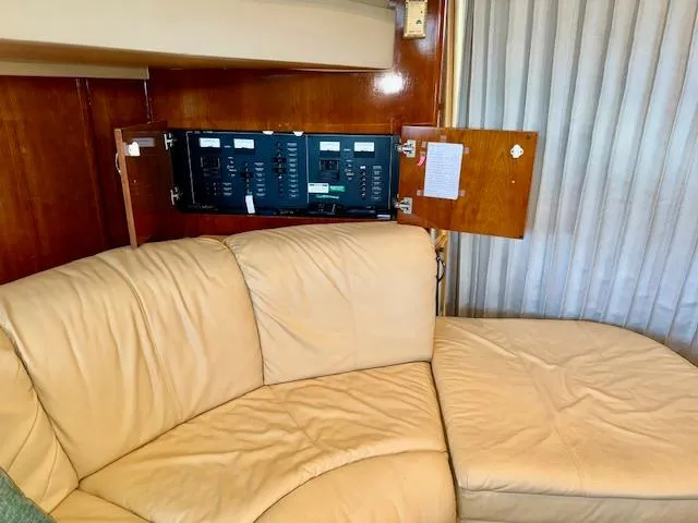 Slide: The Image of 2003 Carver 410 Sport Sedan interior with beige leather seating and control panel. - 44